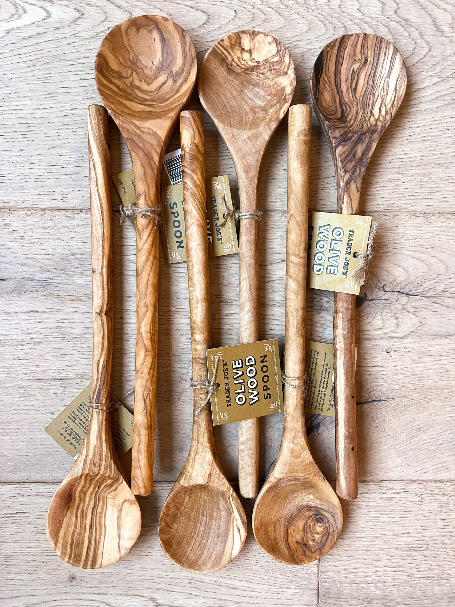 beautiful olive wood spoons lined up together