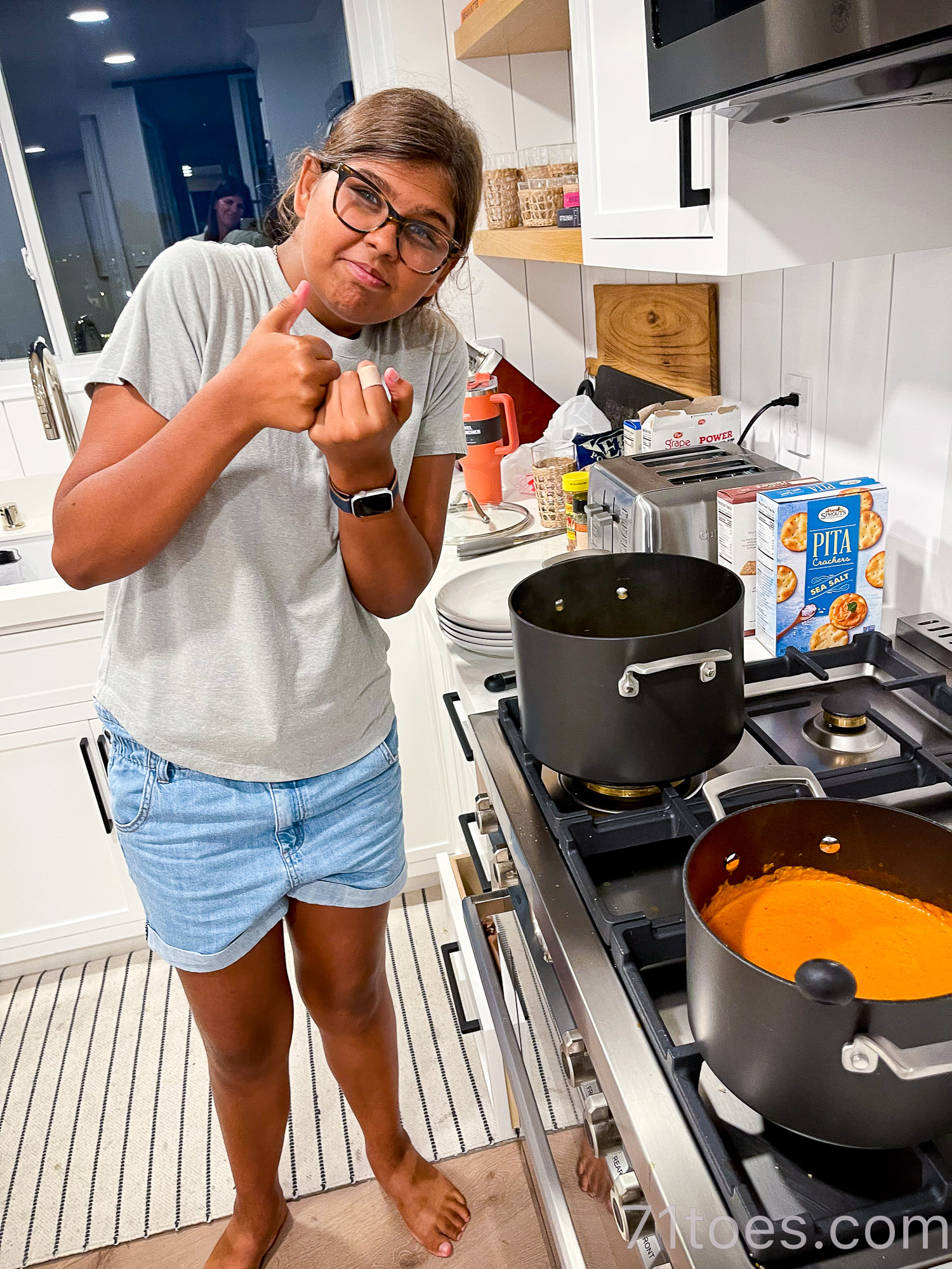 Lucy making pasta sauce for her summer goals