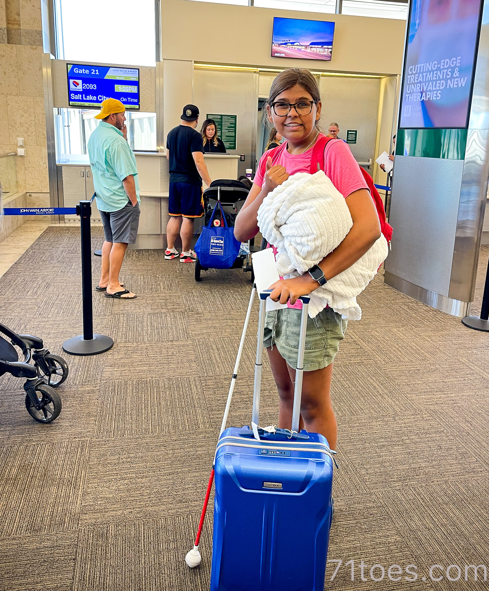 Lucy heading on a flight by herself, helping her with summer goals to gain independence