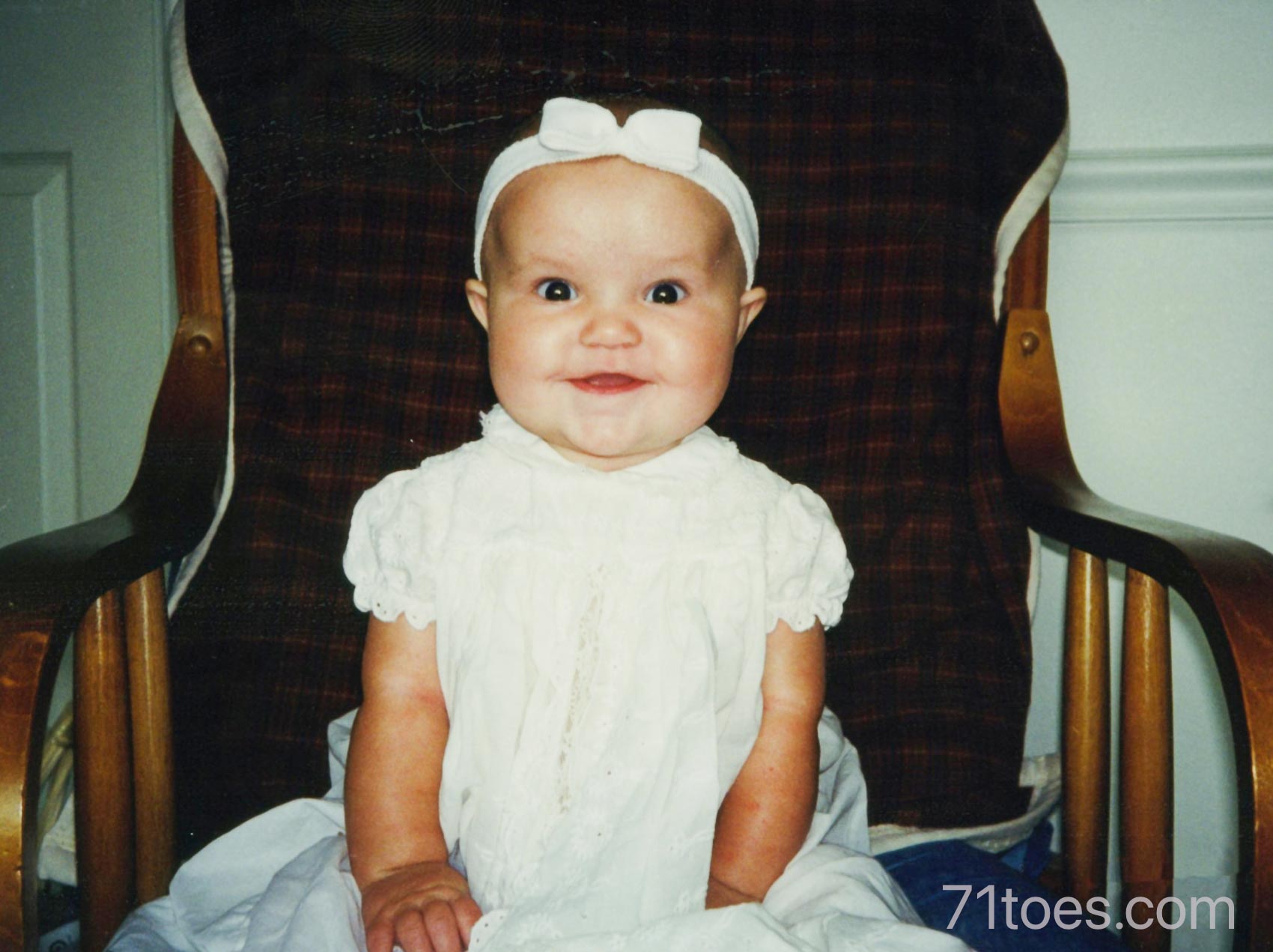 Abby in the same blessing dress when she was a baby