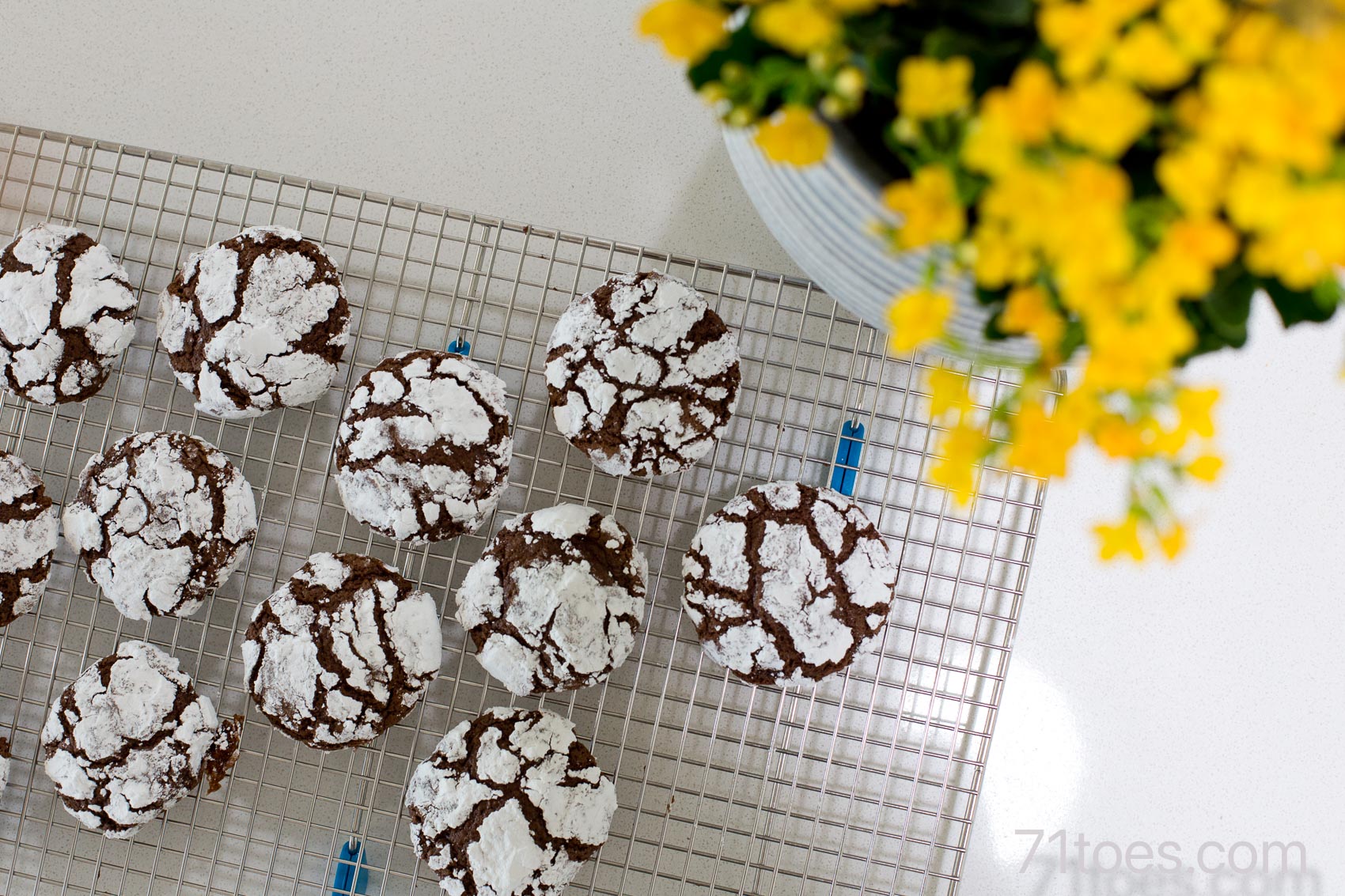 chocolate crinkle cookies on a cooling rack