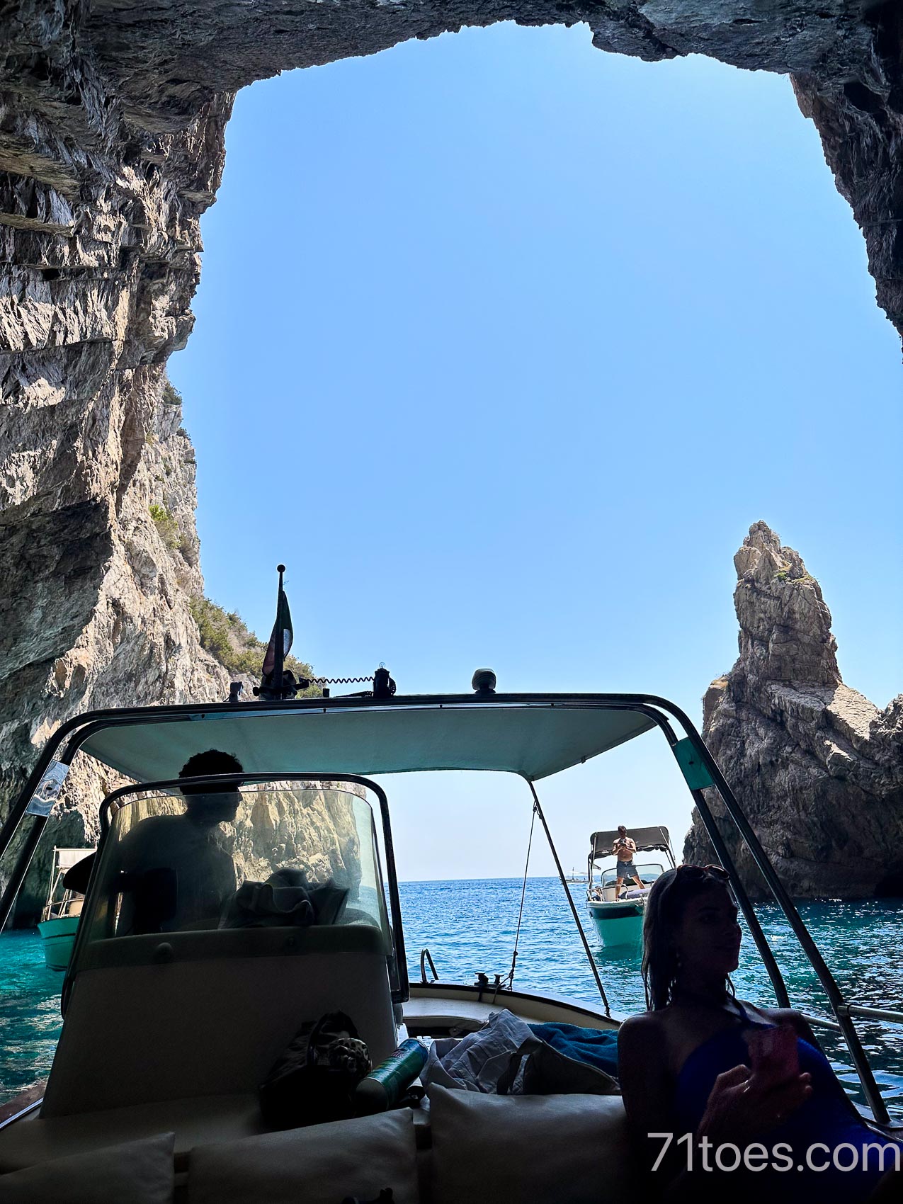 on a boat exploring the almalfi coast